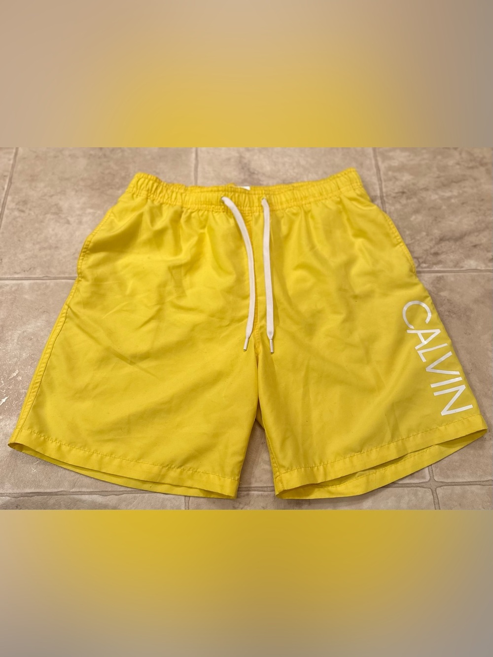Calvin Klein Yellow Men’s Swim Trunks with White Logo